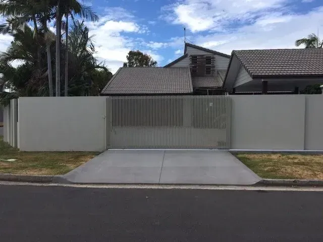 A House With a Fence and a Driveway in Front of It — Sunshine Gates in Kunda Park, QLD