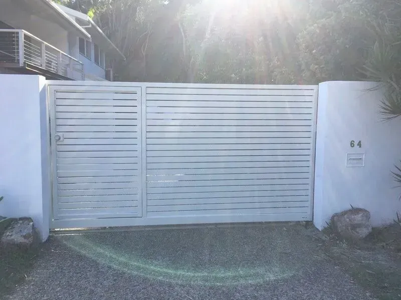 A White Gate With the Number 44 on It — Sunshine Gates in Kunda Park, QLD