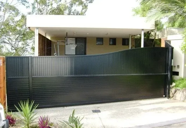 A House With a Black Sliding Gate in Front of It — Sunshine Gates in Kunda Park, QLD