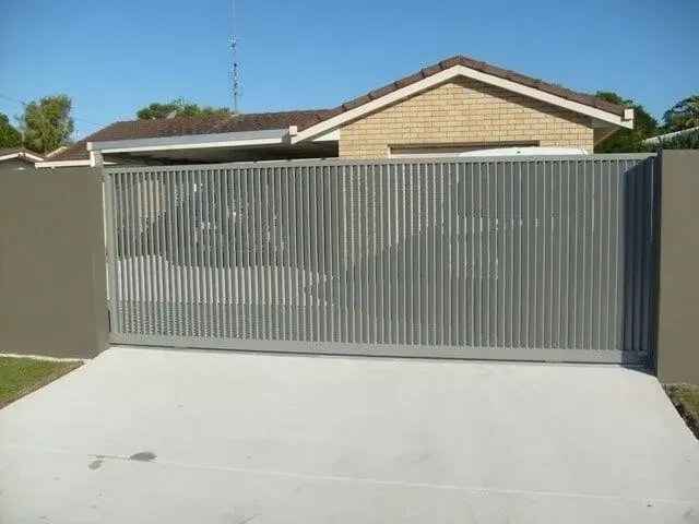 A House With a Sliding Gate in Front of It — Sunshine Gates in Kunda Park, QLD