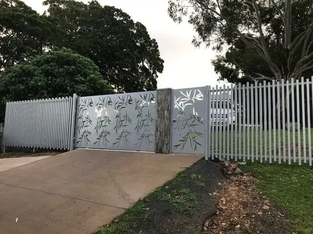 A White Picket Fence Surrounds a Driveway and a Gate — Sunshine Gates in Kunda Park, QLD