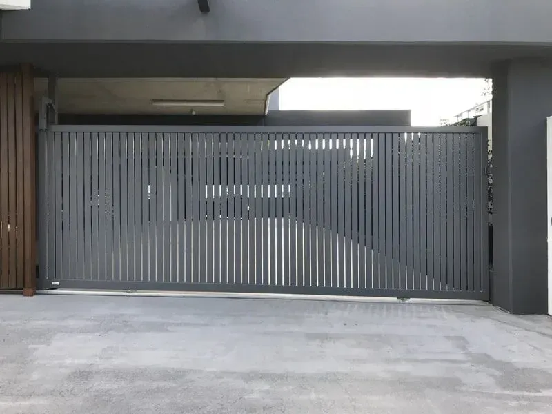 A Black Sliding Gate is Open to a Driveway — Sunshine Gates in Kunda Park, QLD
