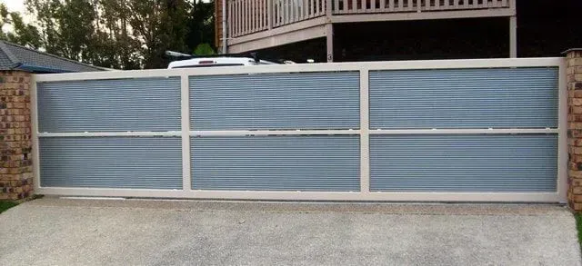 A Sliding Gate is Sitting in Front of a House — Sunshine Gates in Kunda Park, QLD