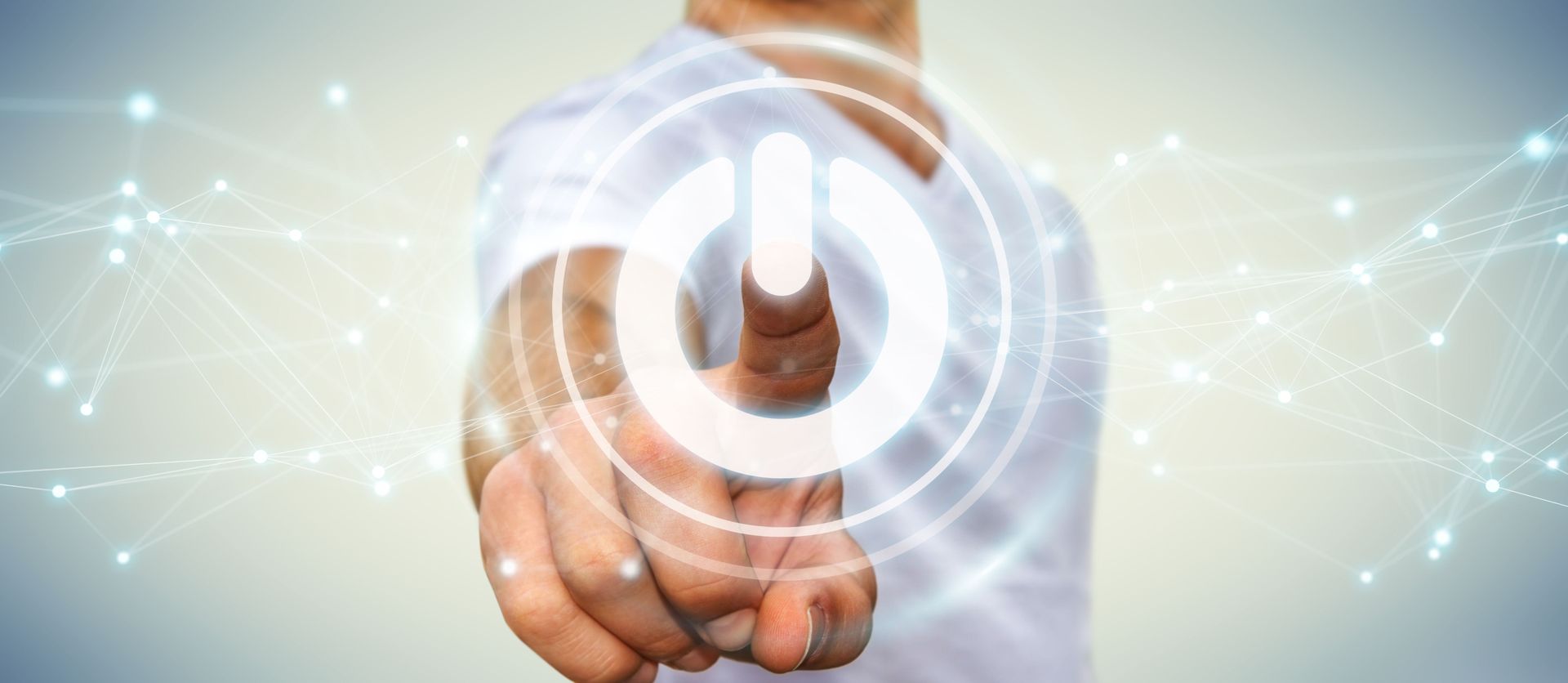 A man is pressing a button on a virtual screen.