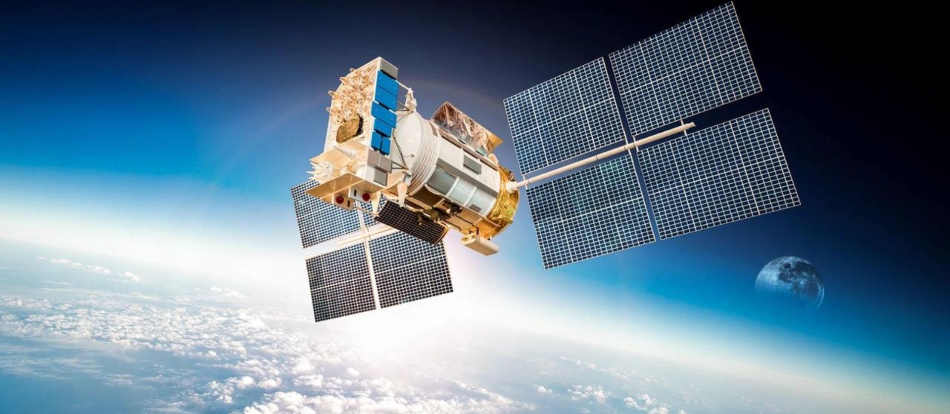 A satellite is flying over the earth in space.