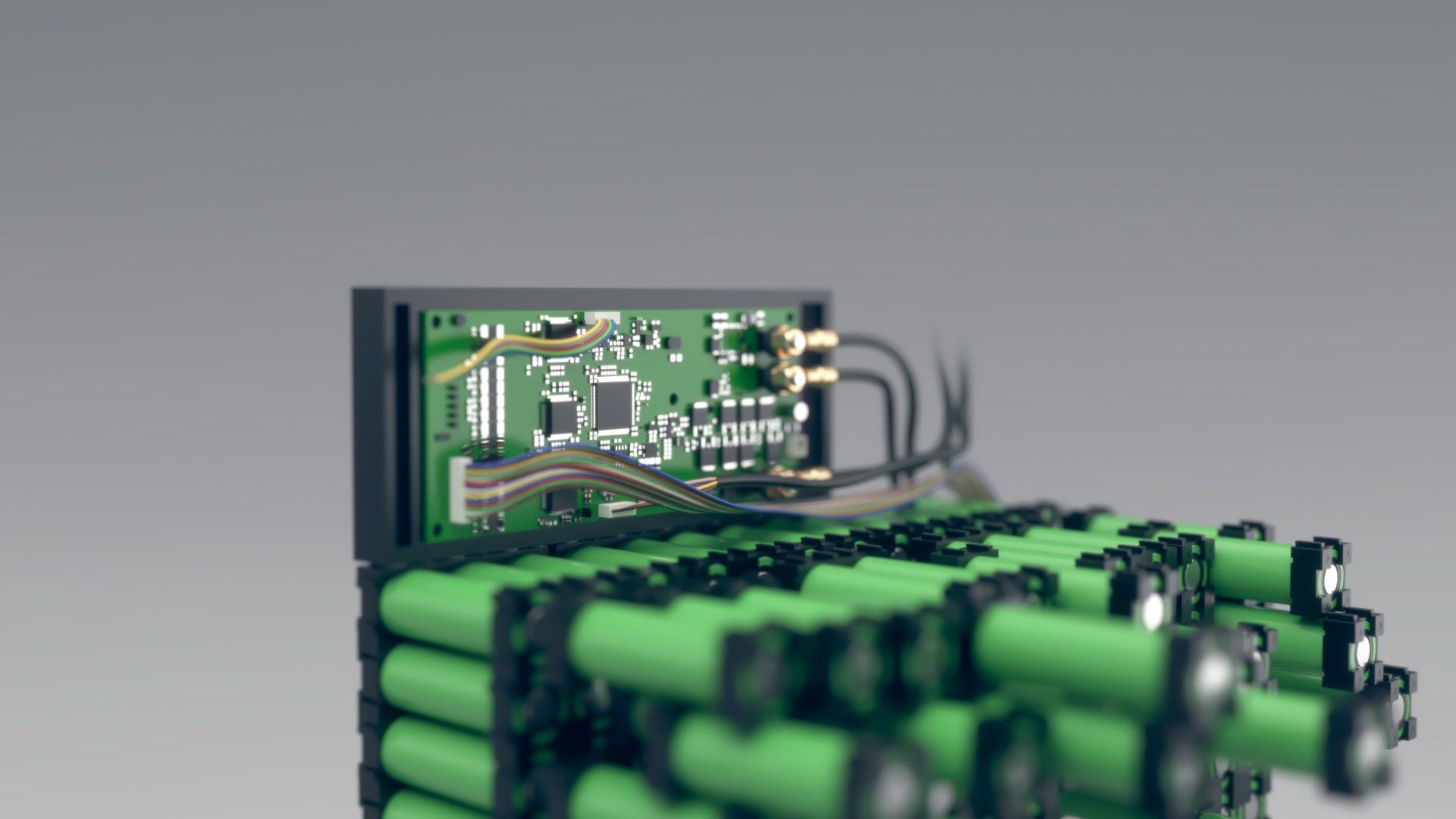 A bunch of green batteries are stacked on top of each other.