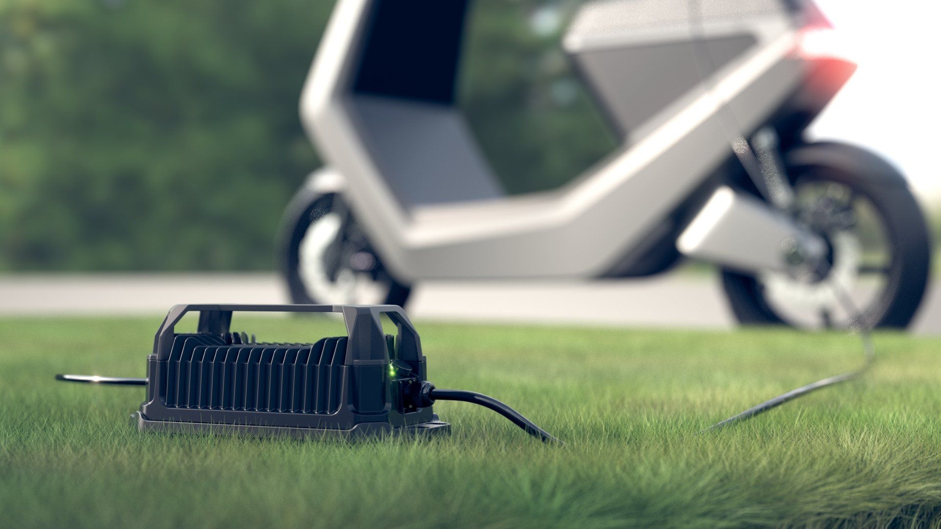 An electric scooter is being charged by a charger on the grass.