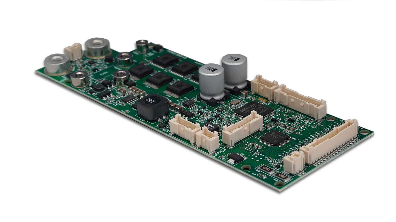 A green motherboard with two capacitors on top of it