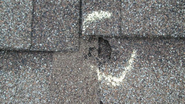 A close up of a roof with a hole in it.