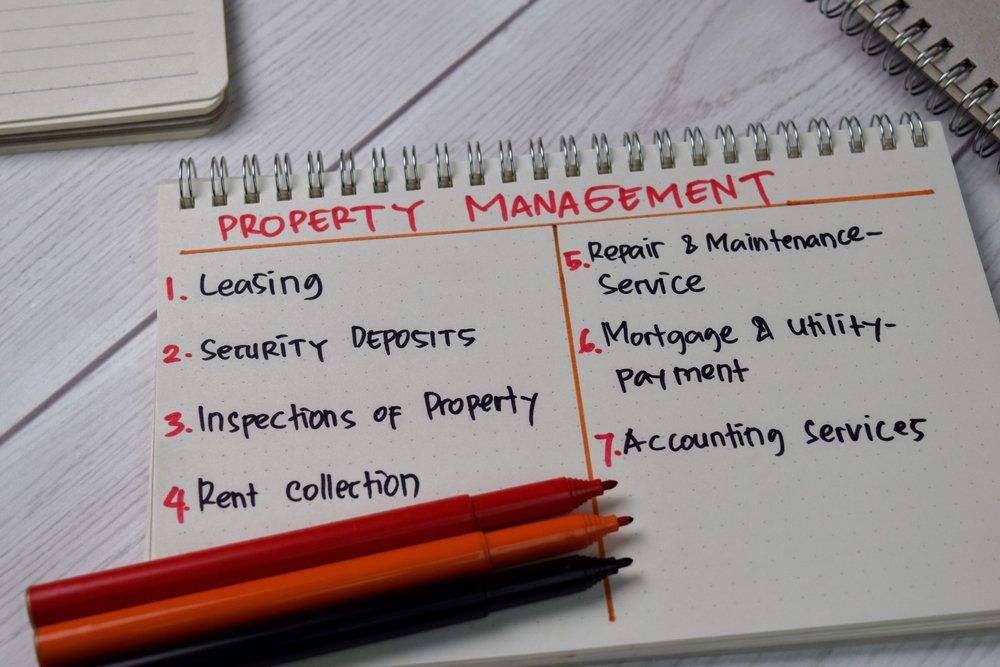 Property Management Written On A Notebook — Austin, TX — Property Management Of Texas Property Management Written On A Notebook — Austin, TX — Property Management Of Texas