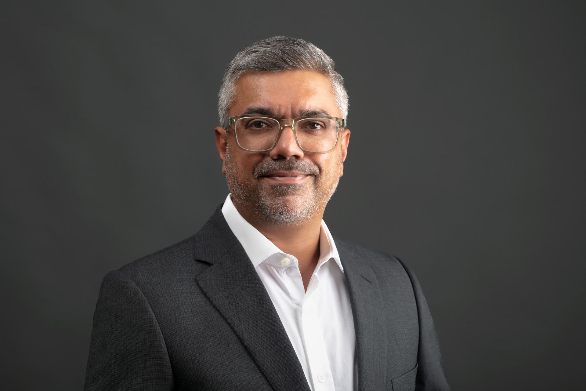 Umesh Chauha, founder of Marlin Human Capital smiling for the camera.