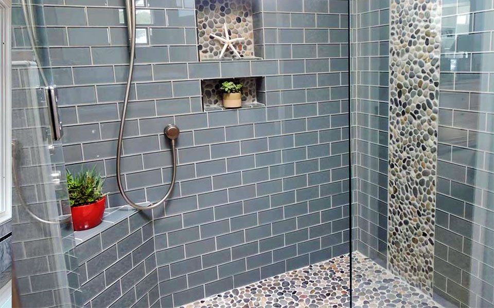 Beautiful resin pebble effect shower feature