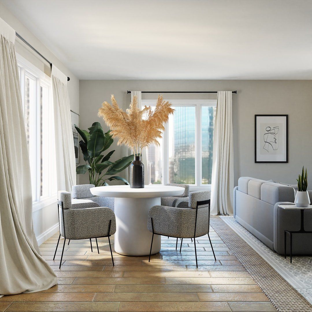 small dining area with a table and two chairs and an orange feather light