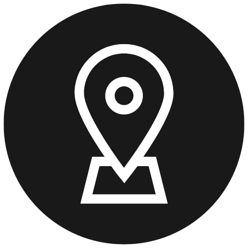 White location pin icon inside a black circle