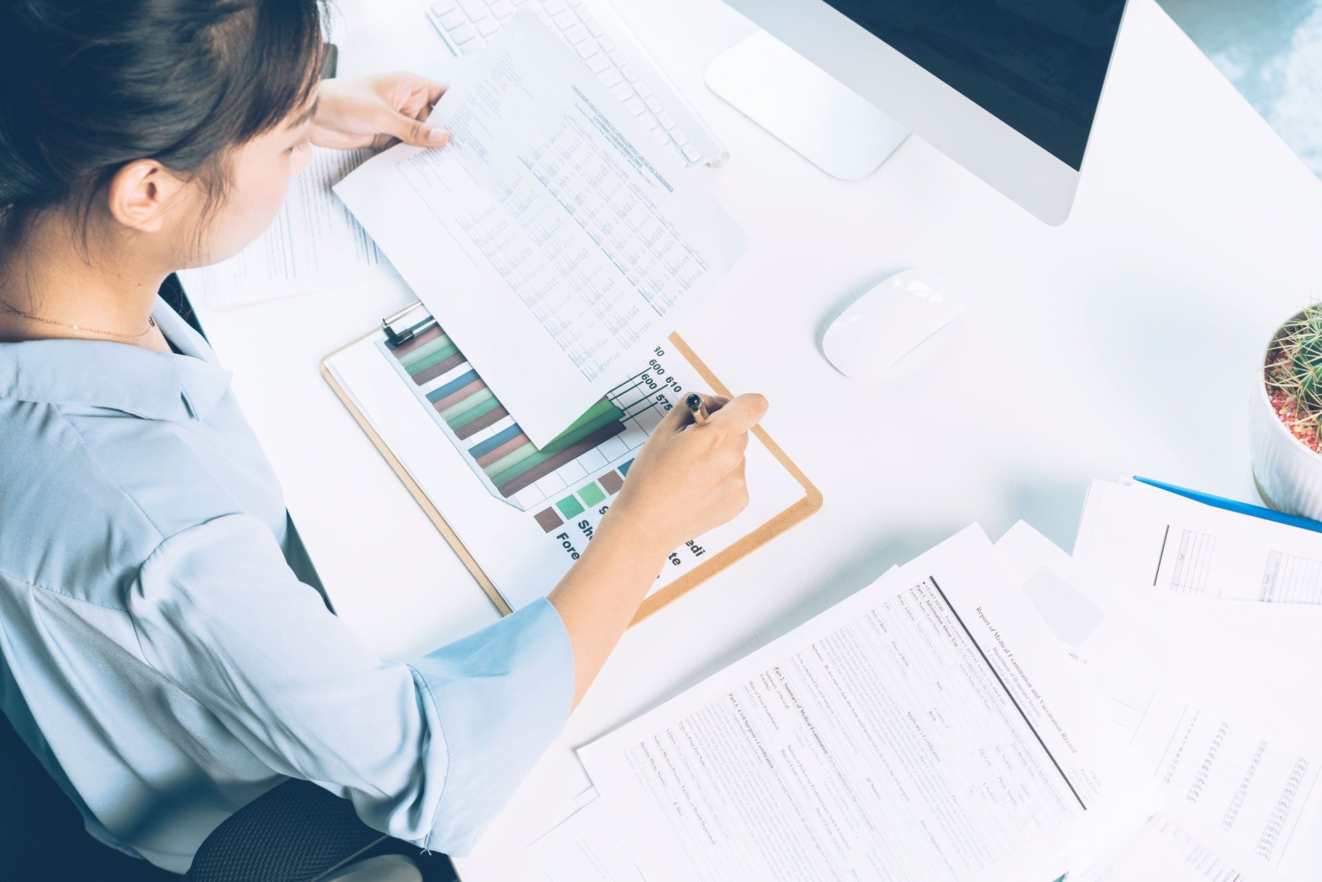 Businesswoman Analyzing Document with Pen in Office | Brisbane Qld | Mta-More Than Accountants Pty Ltd Businesswoman Analyzing Document with Pen in Office | Brisbane Qld | Mta-More Than Accountants Pty Ltd