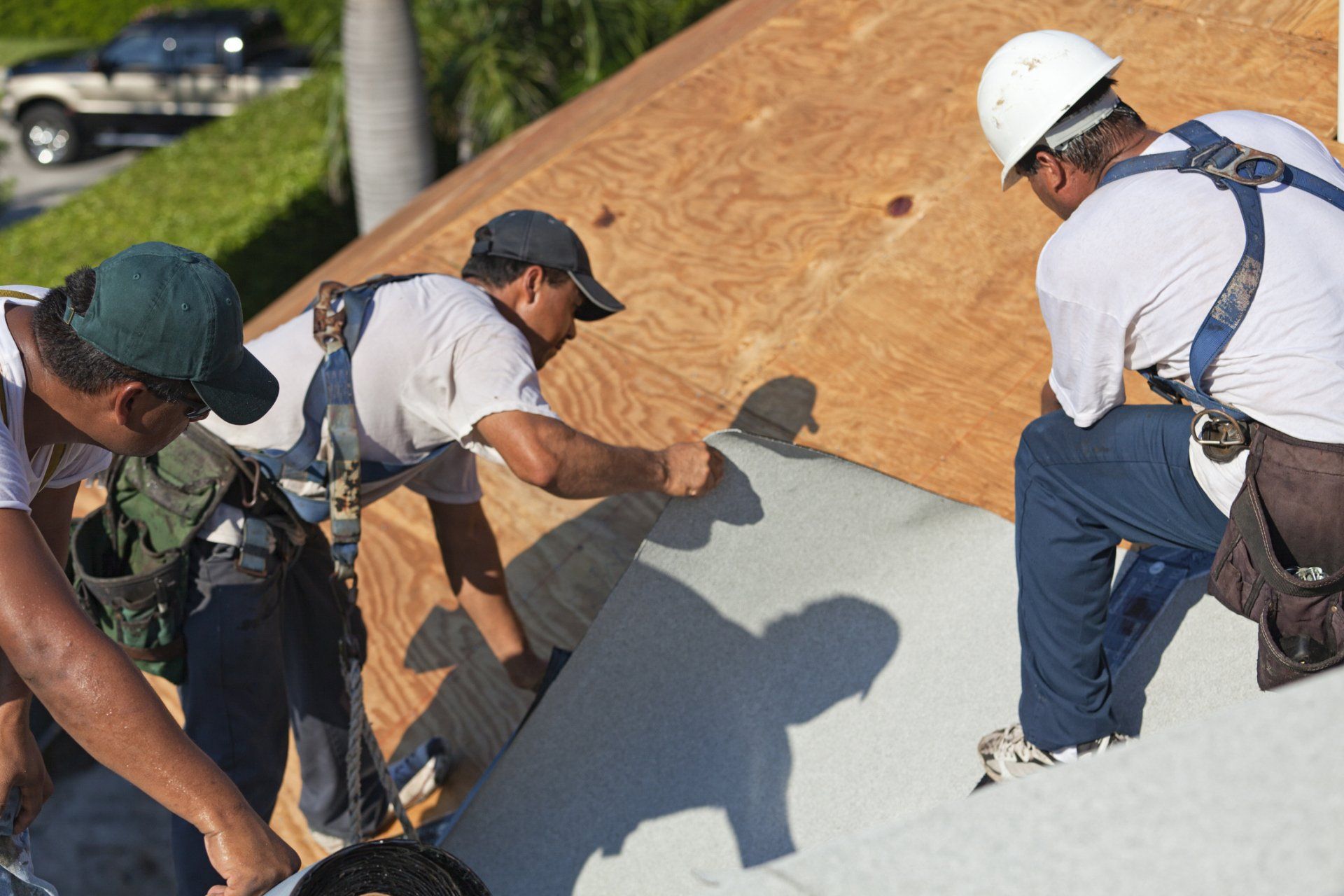 Three Roof Service Team Doing Repair — Pensacola, FL — Jackson Roofing Company Inc. Three Roof Service Team Doing Repair — Pensacola, FL — Jackson Roofing Company Inc.