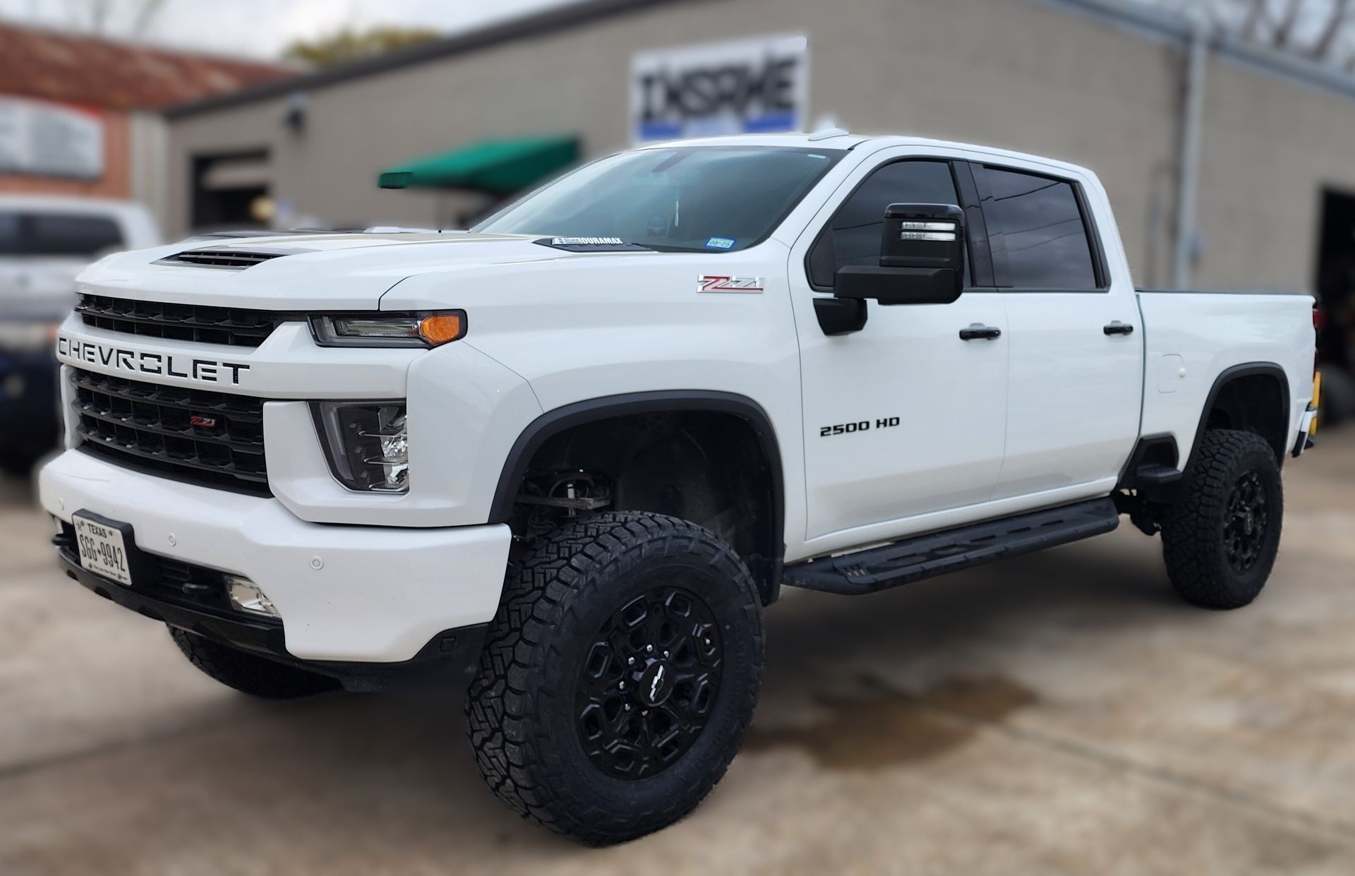 White Chevrolet Silverado Pickup Truck with Off-Road Tires | Insane Automotive and Offroad