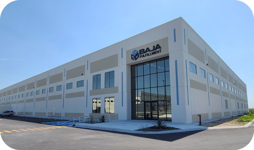 Modern white commercial building with blue glass entrance and