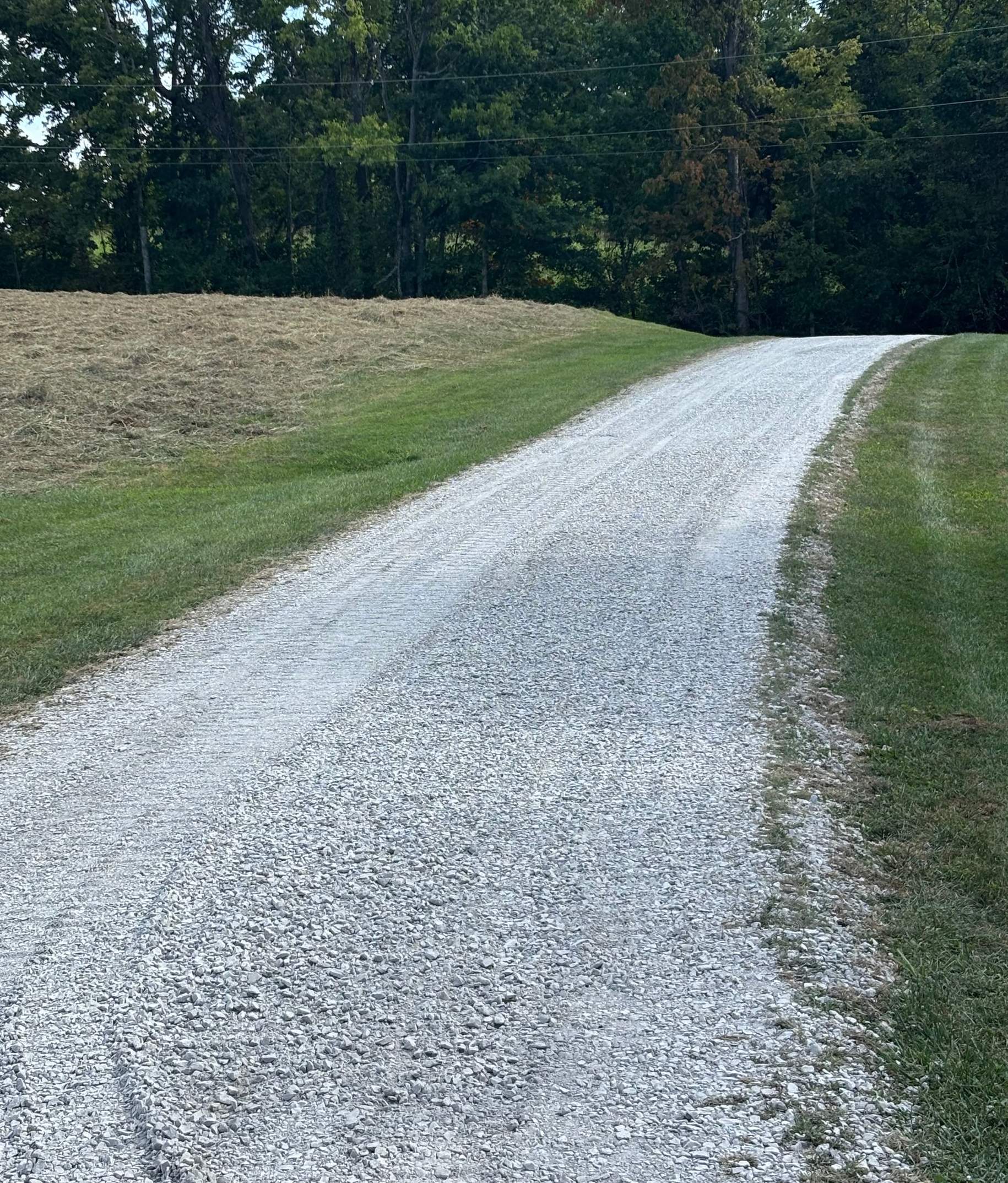 Gravel driveway rebuild on Loudon Rd in Georgetown Ohio after grading, drainage correction, and #411