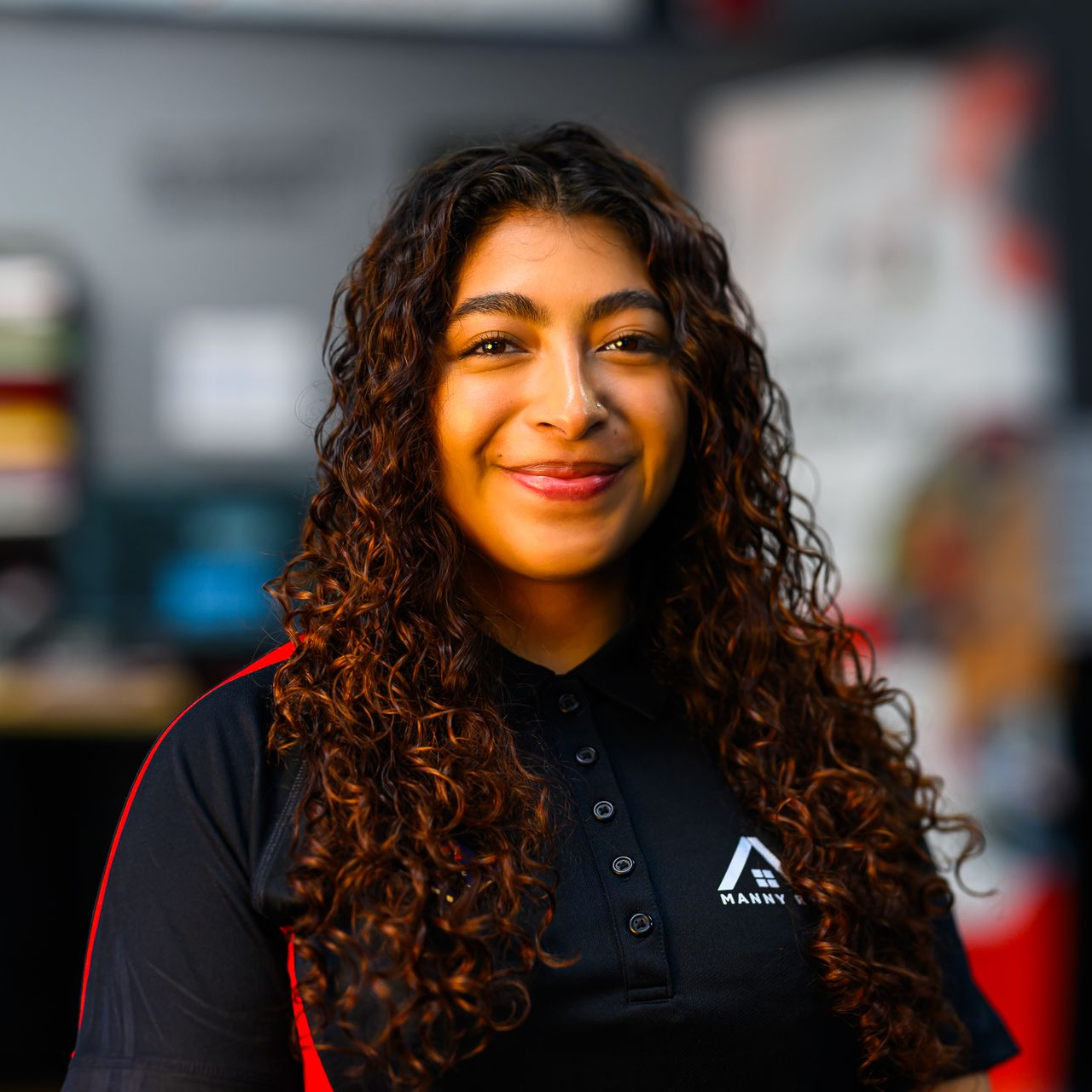 Photo of Melany, Graphic Designer at Manny Roofing.