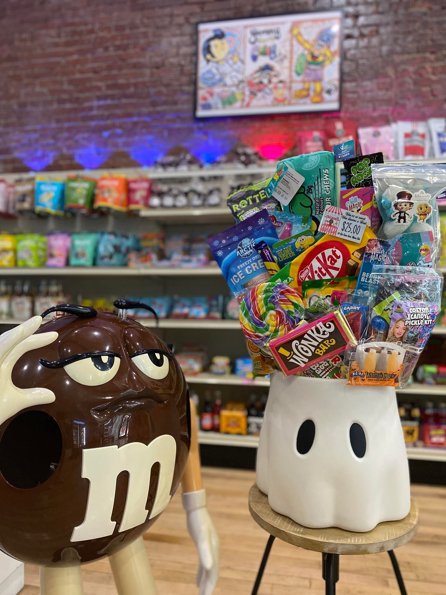 M&M’s display with giant chocolate and marshmallow characters in a candy shop, surrounded by colorful sweets