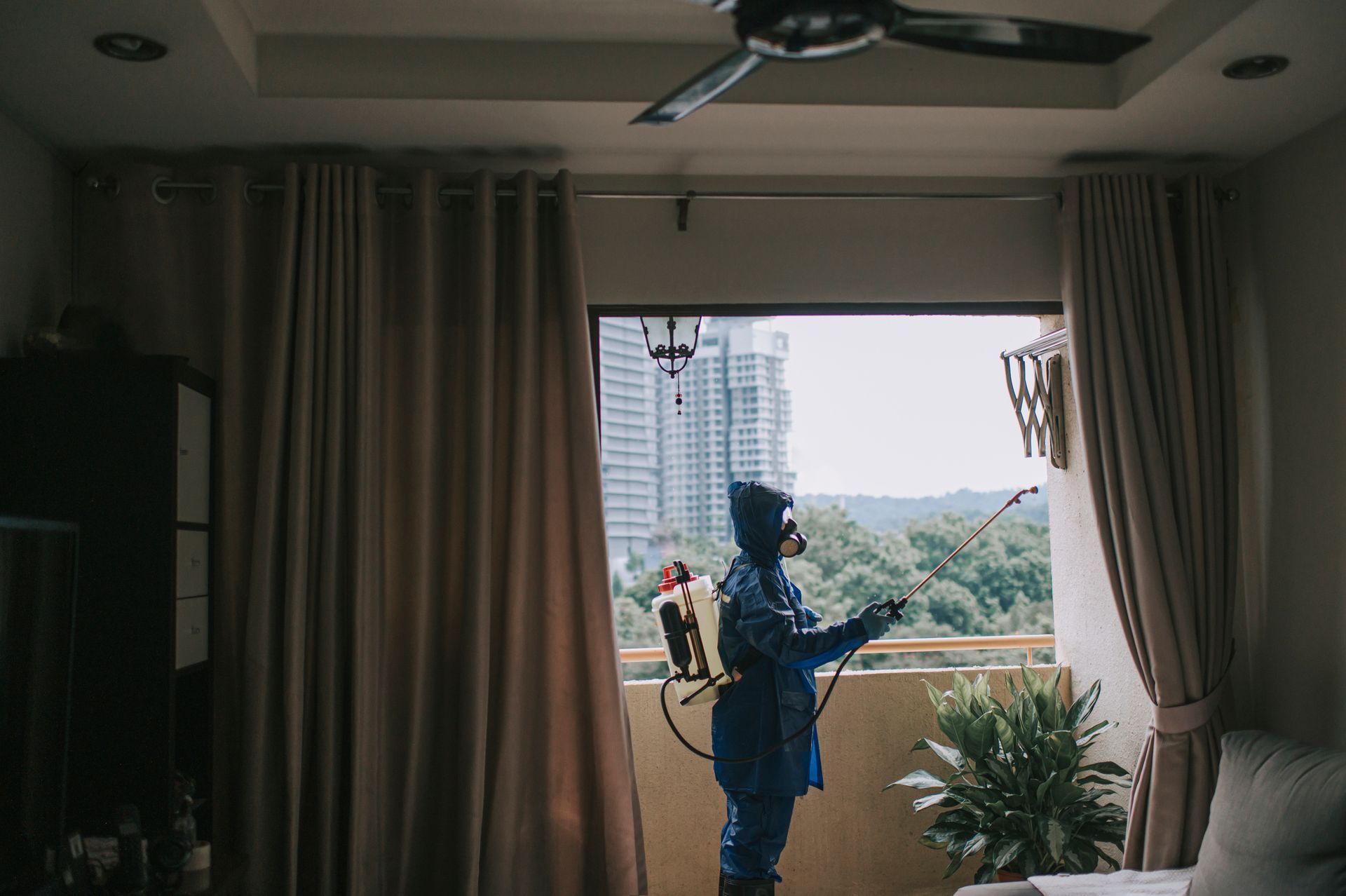 A person is spraying a chemical.