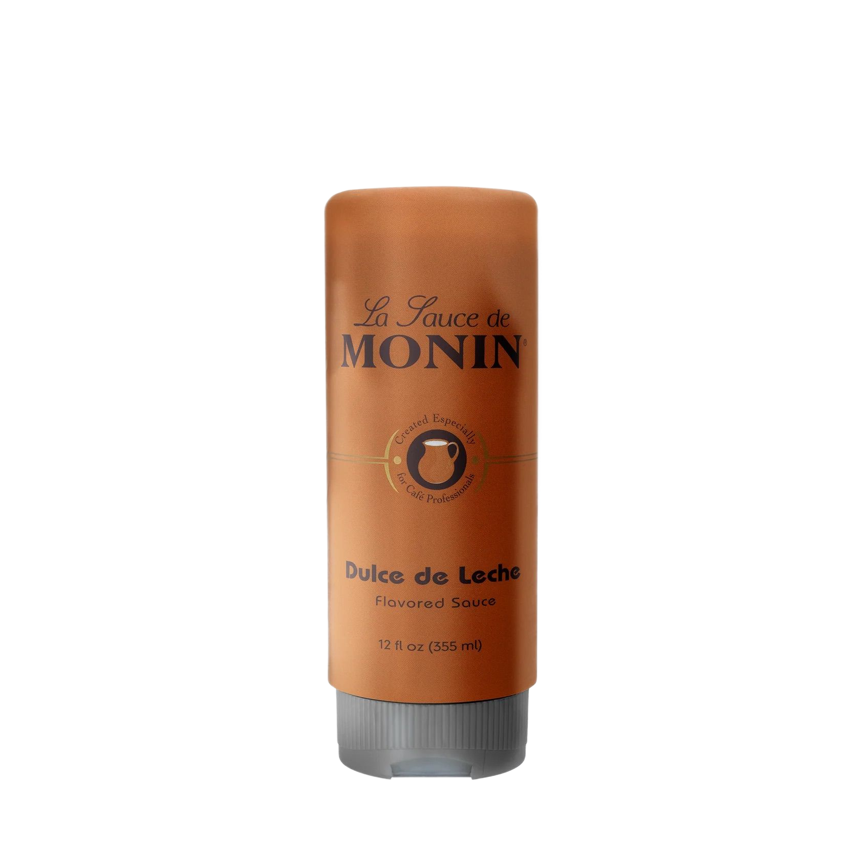 Bouteille de sirop Monin Dulce de Leche avec étiquette brune et bouchon argenté sur fond blanc