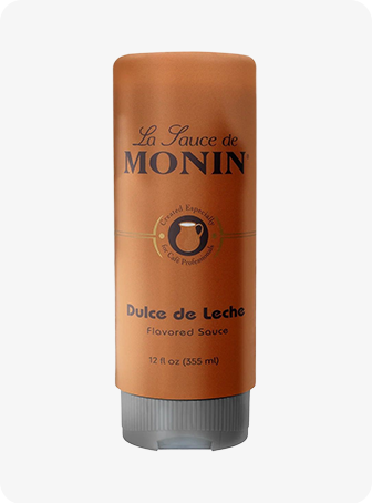 Bouteille de sauce Monin Dulce de Leche marron avec bouchon et étiquette gris