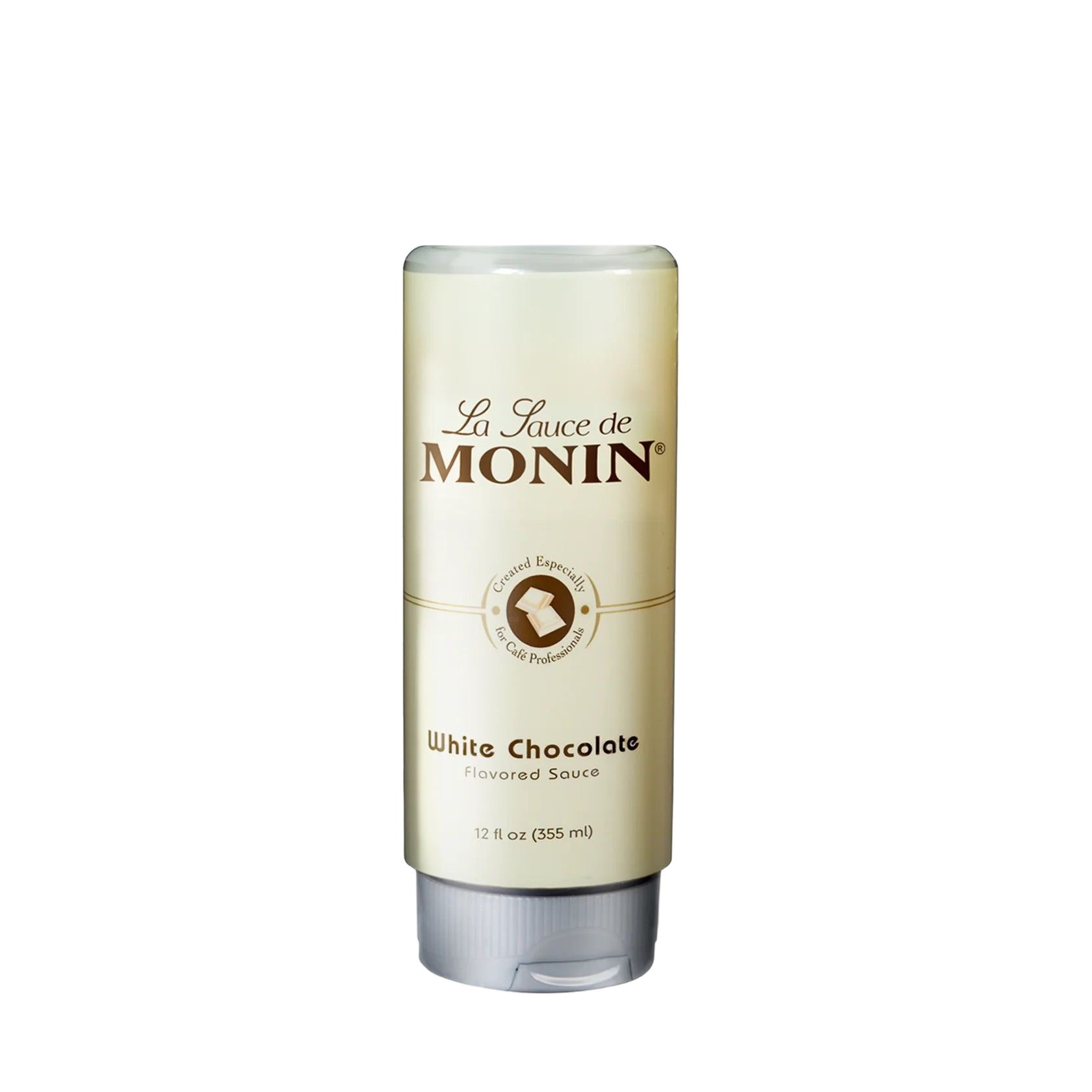 Bouteille de sirop de chocolat blanc Monin avec étiquette crème et bouchon argenté sur fond blanc
