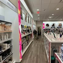 A store interior with shelves displaying beauty products.