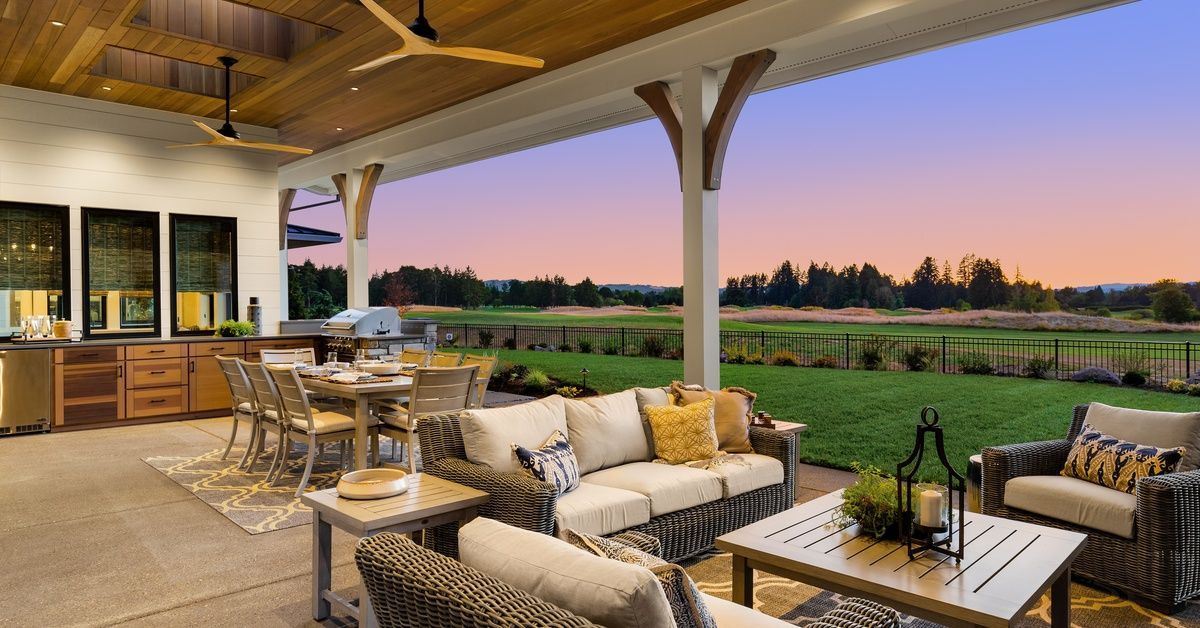 A luxury patio attached to a Southern California home. The patio features a full kitchen and dining area with amenities.