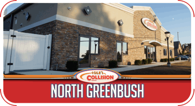 Collision North Greenbush auto body shop exterior with red sign and tan brick building