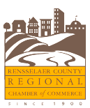 Rensselaer County Regional Chamber of Commerce logo with town skyline and flowing landscape in brown and gold