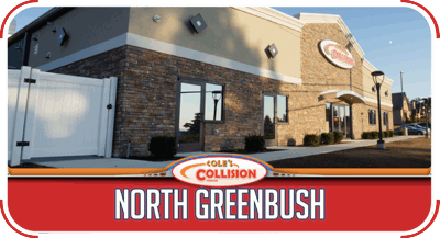Collision shop exterior with red awning and sign reading “North Greenbush”