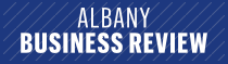 Albany Business Review logo in white text on a blue diagonal-striped background