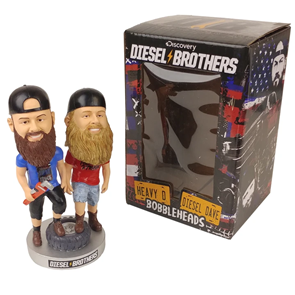 Diesel Brothers bobblehead figurines in a retail box, one bearded in a cap and one blond-bearded in a red shirt