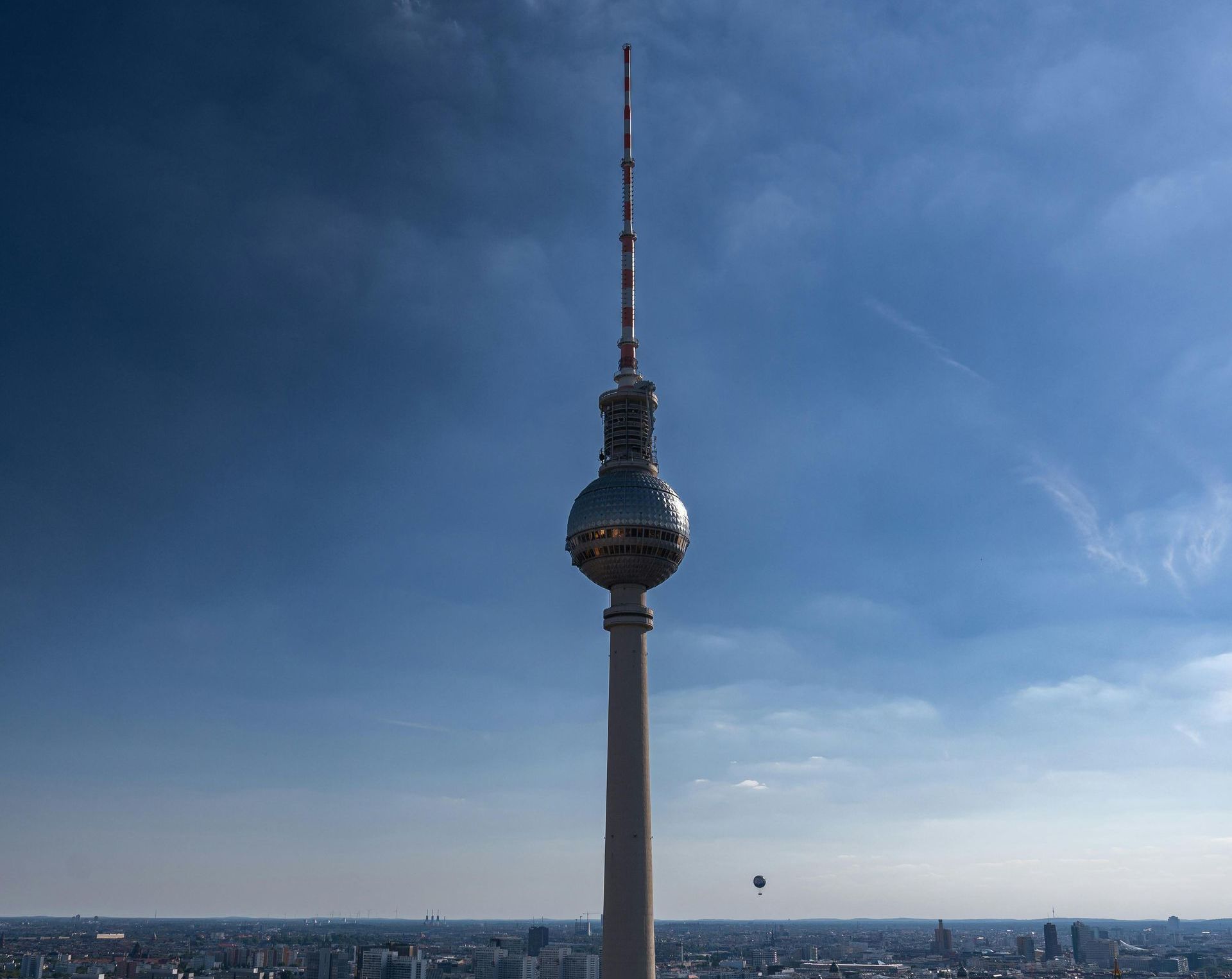 A very tall tower with a blue sky in the background
