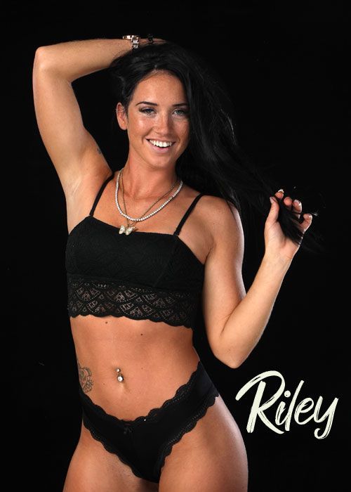 a woman in black lingerie is named riley