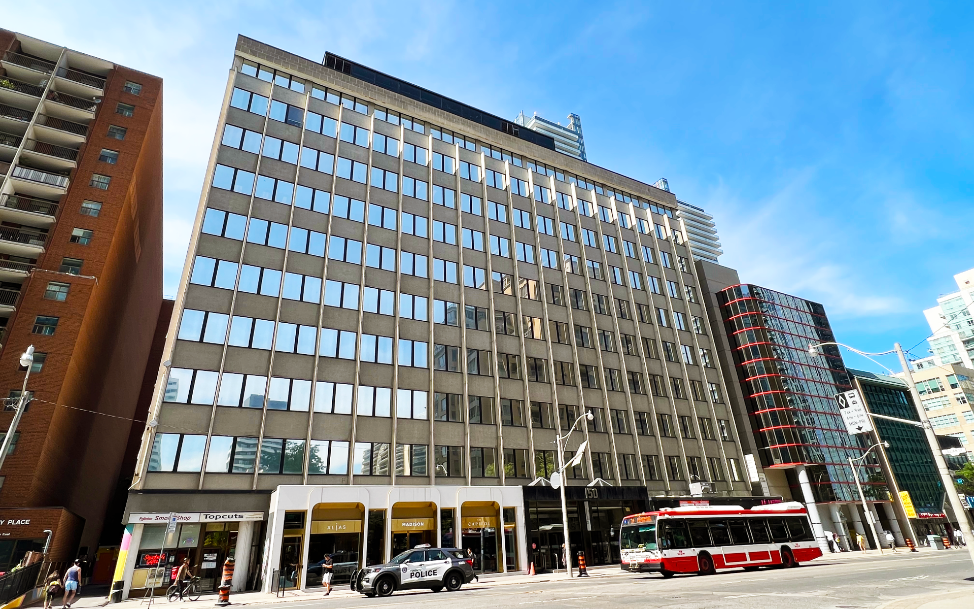 Office building in downtown Toronto, with a passing streetcar on a sunny day.