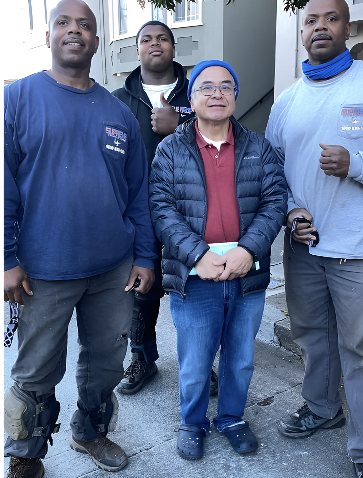 A group of men are posing for a picture together