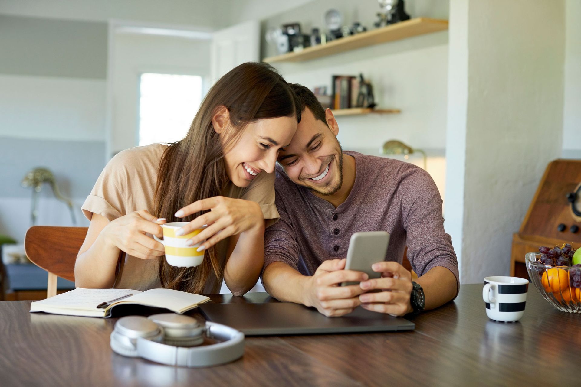 Photo of a couple looking at a phone - click to view tenant portal page