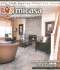 A living room with a fireplace and stairs on the cover of a magazine.