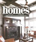 A living room with a fireplace and a ceiling fan on the cover of a magazine.
