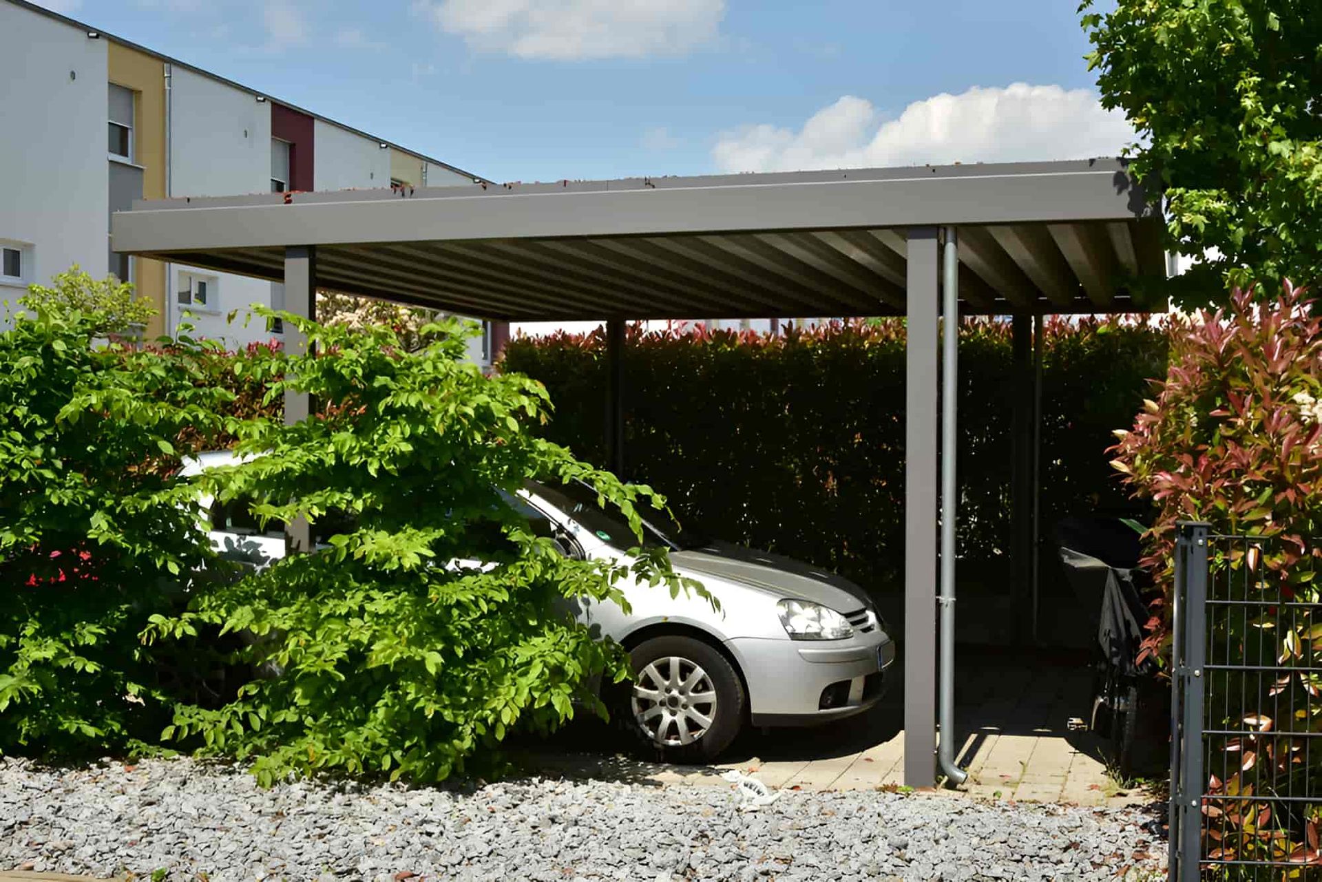A Silver Car is Parked Under a Carport — Pride Carpentry & Maintenance In Central Coast, NSW