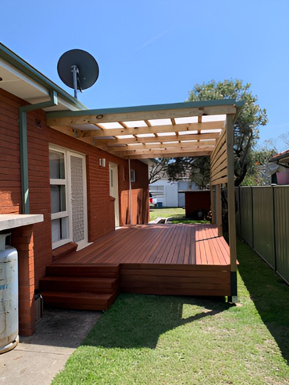 A Wooden Deck With a Shaded Pergola — Pride Carpentry & Maintenance In Berkeley Vale, NSW