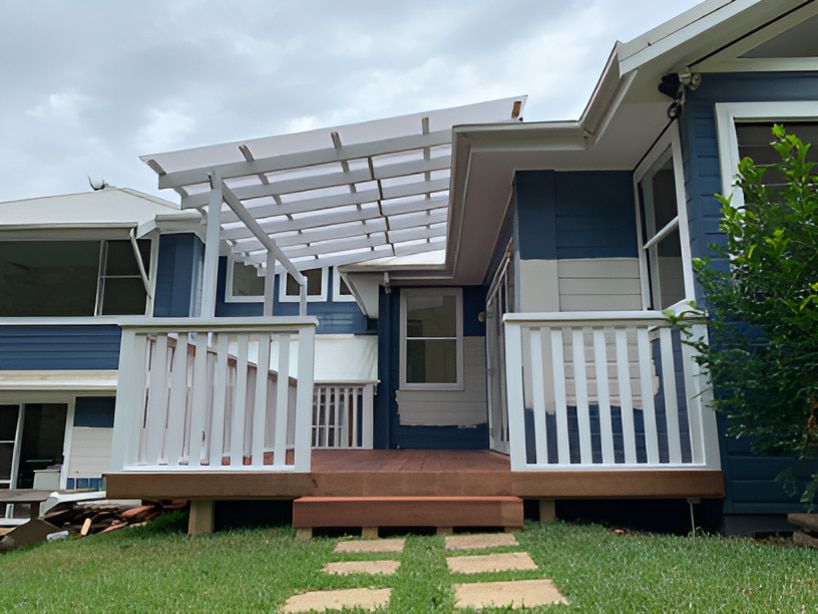 Blue House Featuring a Pergola — Pride Carpentry & Maintenance In Berkeley Vale, NSW