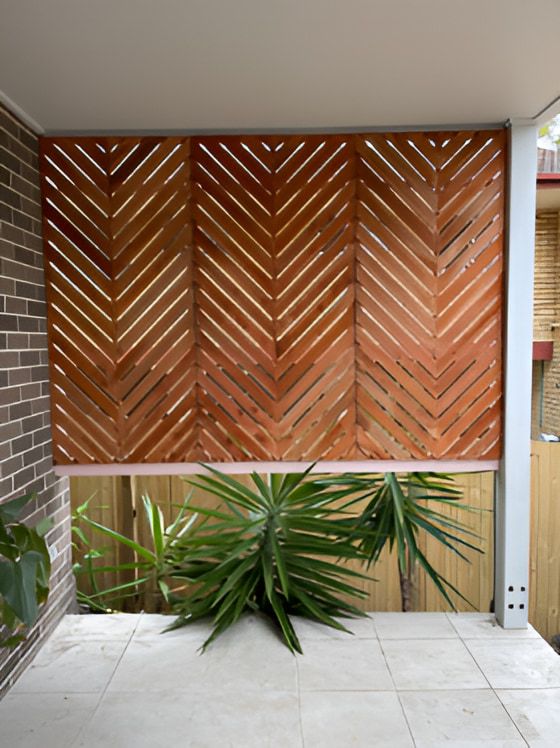 A Wooden Privacy Screen Offers a Private Area — Pride Carpentry & Maintenance In Berkeley Vale, NSW