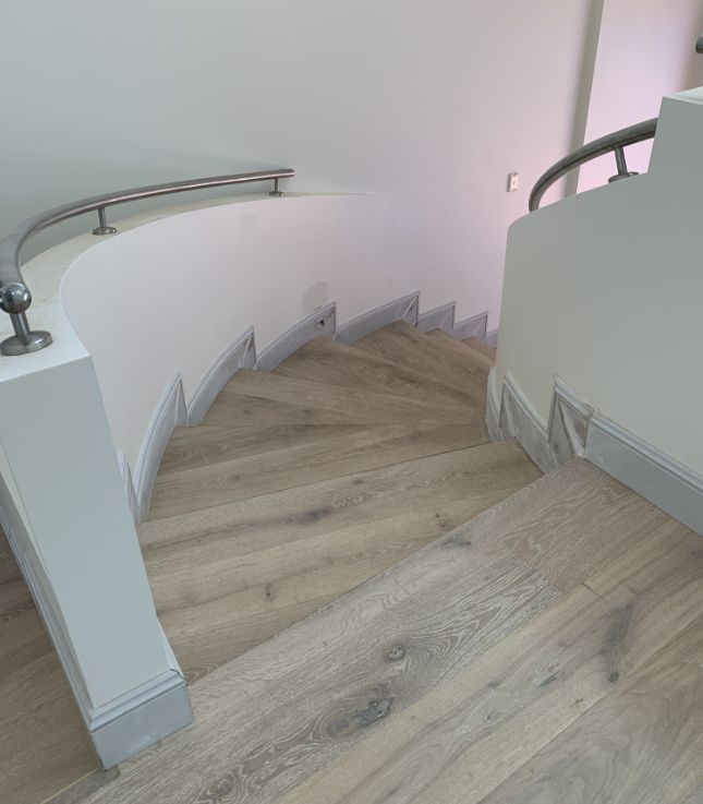 A Staircase With Wood Flooring — Pride Carpentry & Maintenance In Berkeley Vale, NSW