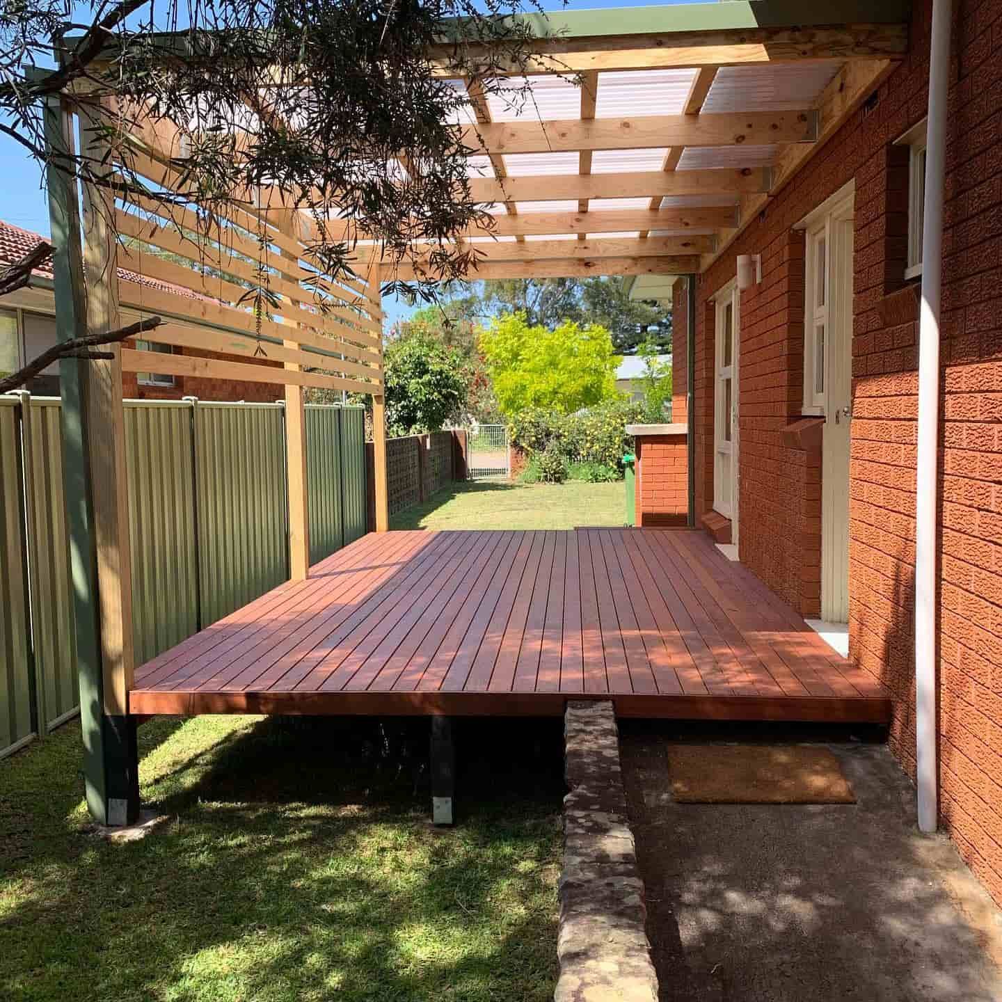 A Deck With a Pergola and a Fence — Pride Carpentry & Maintenance In Berkeley Vale, NSW