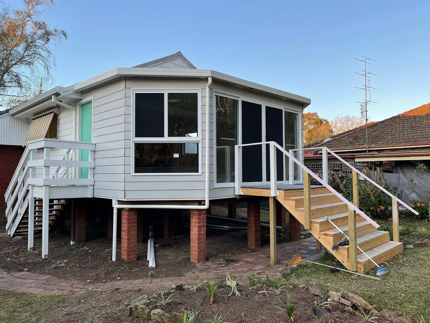 A House With a Deck and Stairs — Pride Carpentry & Maintenance In Berkeley Vale, NSW